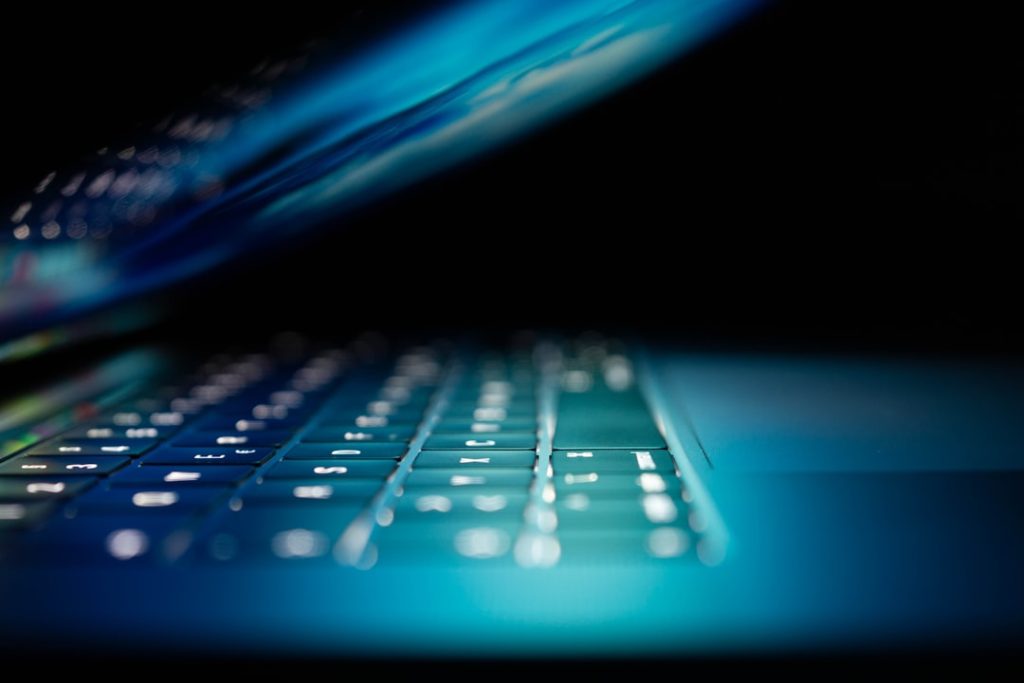 closeup-photo-of-turned-on-blue-and-white-laptop-computer-iijruoerocq