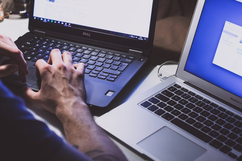 person-using-black-laptop-computer-i-poqp6kcoi